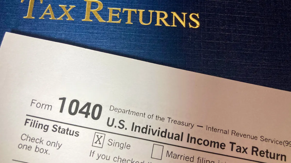 Child tax credit: who qualifies and how it works Tax return form with headline text
